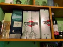 My upper shelf. Sadly, mostly from last year, awaiting company to help me drink it...