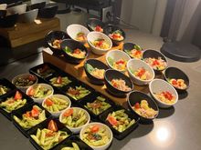 A pasta dish and ham and pineapple salad