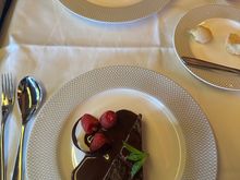 Chocolate tart sans ice cream. I asked about it, and was told that other passengers got to it first (we ate about 2.5 hours into the flight). Oh well. 