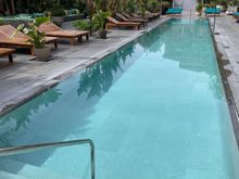 Pool deck, loungers chairs and a large seating area not pictured. 