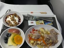 Pre-landing meal, Pork with noodle, I forget the name of the dish. This was excellent----once I put on some of  the hot sauce I bought with me. 7/10.  

I am not impressed with catering out of NRT or HND. I actually feel that the catering out of YYZ is pretty good. 