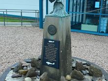 monument to Capt. E. E. Furness, OBE — the pioneer of air service to the Orkney Islands — outside the terminal


various stained-glass representations of noteworthy aircraft, making up a divider in the cafe area 