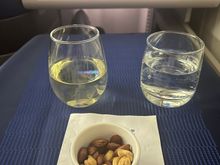 Nuts served warm, even in row 15. Water was proactively offered in addition to main drink requests. 