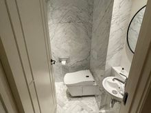 Your knees will fight the wall for space, but hey, at least there is a Toto!