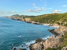 Watching the waves crashing on the beach and rocks 