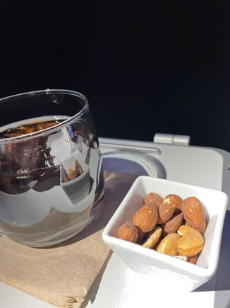 Coca Cola with Warmed Nut Ramekin. 