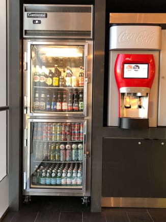 Self-serve fridge and Coca-Cola Freestyle machine near the self-serve bar pictured in the OP.