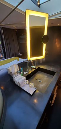 The bathroom sink. The back side is the "headboard" of the bed. The makeup light doesn't shut off on its own.
