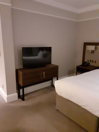 The TV a bit awkwardly placed at the side of the wall ( had to turn it myself as far as it would go to get it into a slightly more comfortable view)