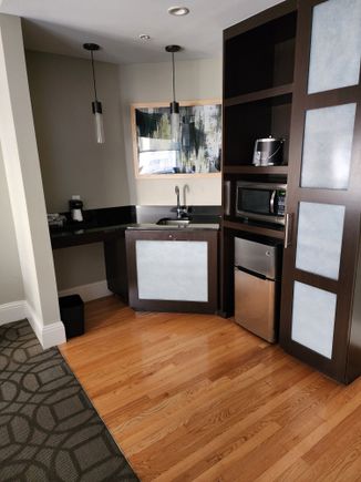 refrigerator, freezer, microwave, bar sink and coffee maker