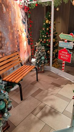 A christmas themed sitting area for photos by the entrance stand ( bit busy so could not get a better photo)
