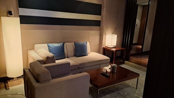 The living room sofa with a filled ice bucket in the evening