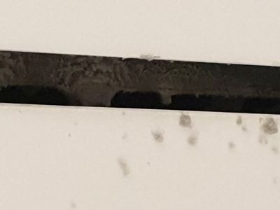 a whole universe of dust bunnies making their snug home in the AC vent above