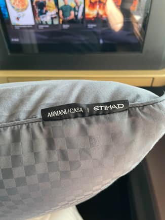 Armani bedding complements the chic look of the seat