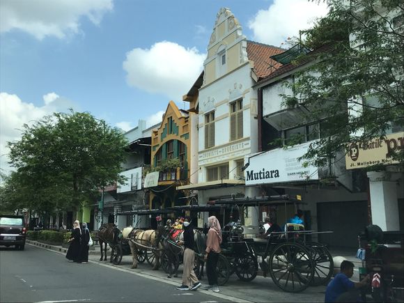Street is filled both sides with shops