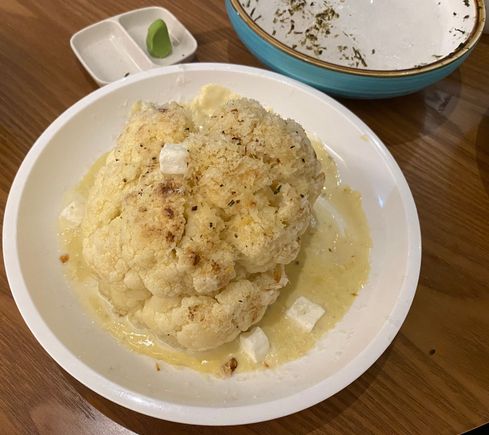 Roasted cauliflower with parmesan & feta cheeses in cream sauce