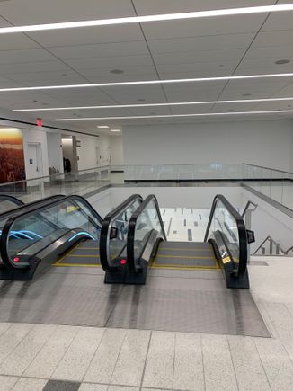 First set of escalators down to…