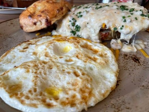 Chicken, biscuits and gravy, with fried egg.