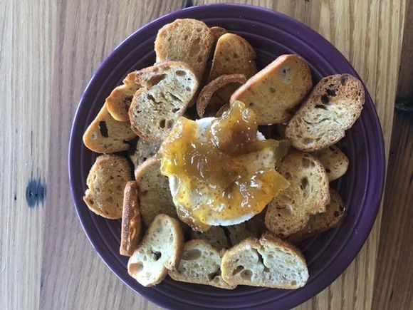 Home made garlic crostini with pepper Boursin cheese and Bonne Maman fig preserves! It turned from an appetizer into dinner!