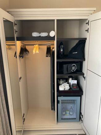 Closet has the essentials, yoga mat / hairdryer / watercooker / minibar (with complimentary milk/water) / slippers / iron & board