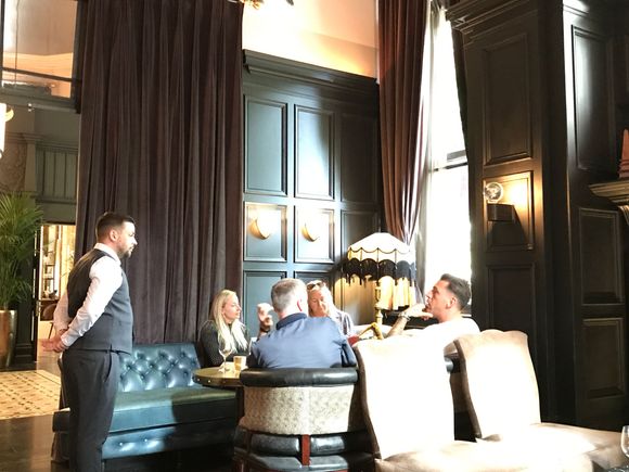 Staff taking wine social hour drink orders