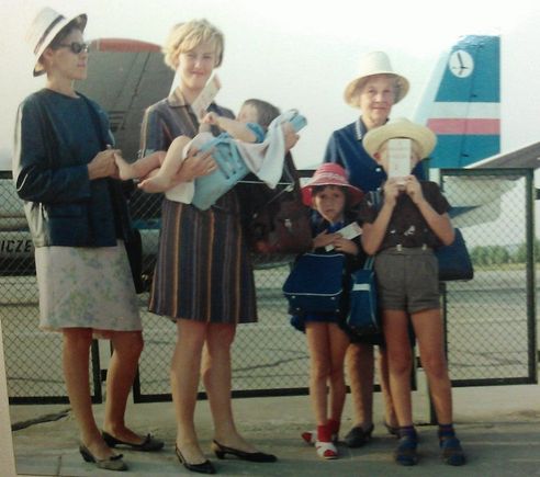 I'll admit it, I didn't take this picture. I'm the one hiding behind my boarding card. 
Aircraft is an AN-24W.
