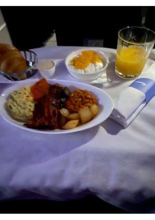 Breakfast served in the dark for all pax as lights didn't come on until 30 mins before landing - no tea or coffee offered and I did ask for coffee but it never arrived. 