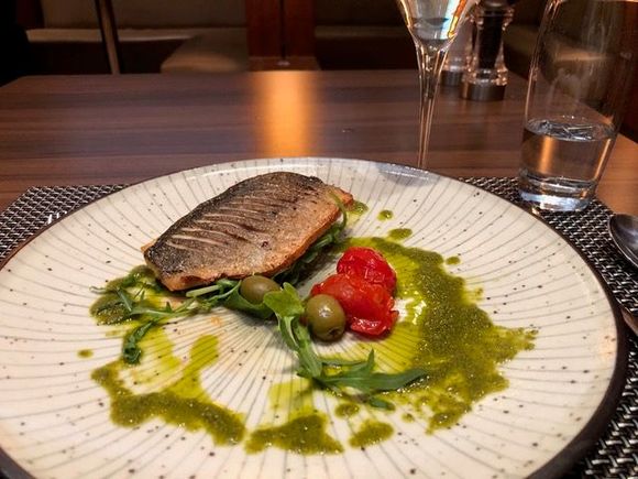 Pan roasted gilt-head bream, baby plum tomatoes, Kalamata olives & caper dressing