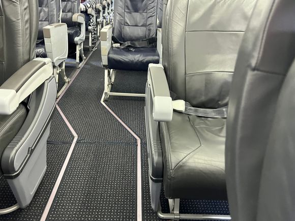 View of aisle from J to Y. On the 9J version seat 4B is missing. 