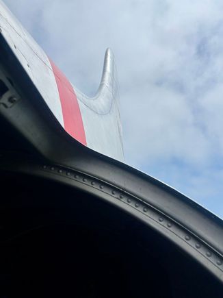 View out of one of the hatches that was open during the flight; too windy to stick your head out but it was possible to see the huge fin (vertical stabiliser). 