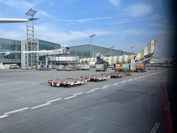 On a Bus approaching Condor’s new A330 Neo parked at a gate.