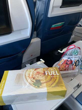 Mid-con Domestic F: regular snack bag of Dasani, Biscoffs, Cheez-its and Purell. Then FA offered a choice of 3 Flight Fuel snack boxes: 1) Hummus; 2) Salami; 3) chips and salsa