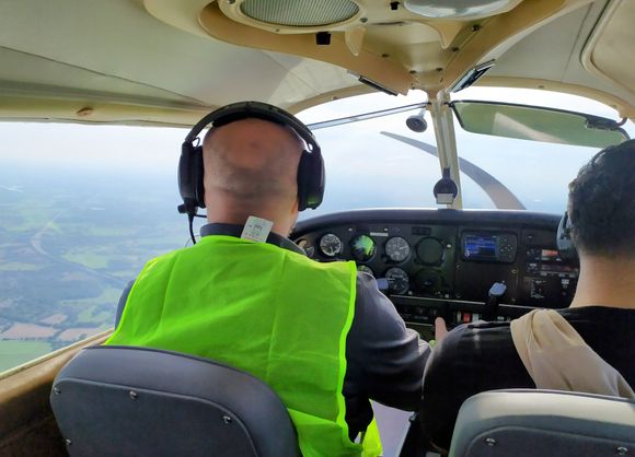 Acker at the controls in the Piper 28 aircraft 