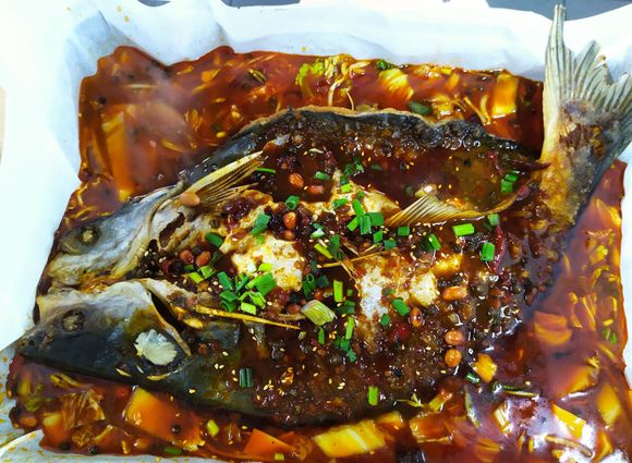 Extremely spicy fish dish at the local food court People's Park in Singapore 