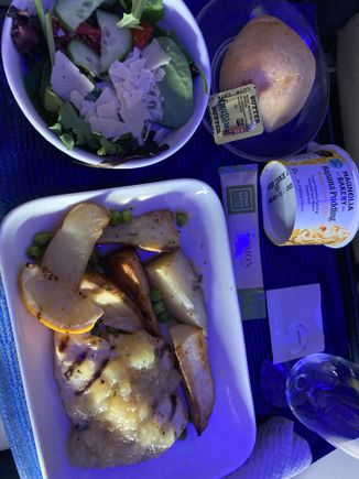 Grilled chicken with potato wedges in lemon sauce
