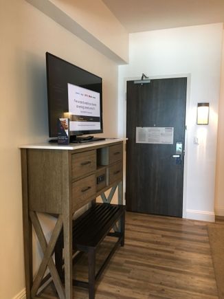 TV and dresser facing living area.