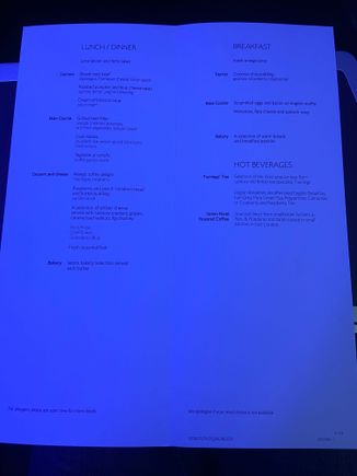 Apologies for the rather dark photo. This was the menu on BA174 from JFK to LHR today. The soup was ok if a little lukewarm. For the main I had the cod which was nice. Wife had the pasta which was apparently a bit bland. Son No.2 had the beef which was a little tough and son No. 1 had more gin! 

The mango pudding was quite nice though I still prefer cheese and biscuits. I could have had both but decided to sleep instead. Refused breakfast in favour of sleep. 