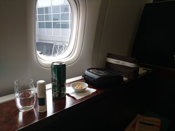 Amenity Kit, Bose Headphones, nuts in a ramekin, sparkling water, water mist spray.
