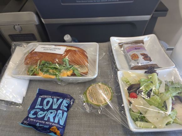 Lunch service - I picked the Pimento cheese sandwich (Turkey sandwich aioli was other option). The salad was the amazing, lettuce was crisp and shaved parm was delicious.