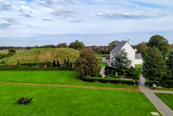 The famous church at Jelling, with a burial mound clearly visible to the left
