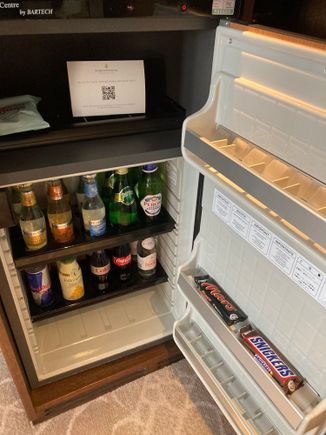Stocked minibar operating with a movement sensor, touch it and pay 