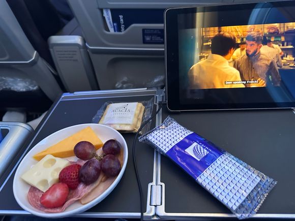 Mid flight snack of cheese, cold cuts and fruit