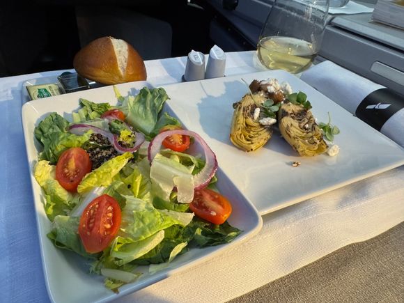 The salad and appetizer arrive together on AA for some reason.