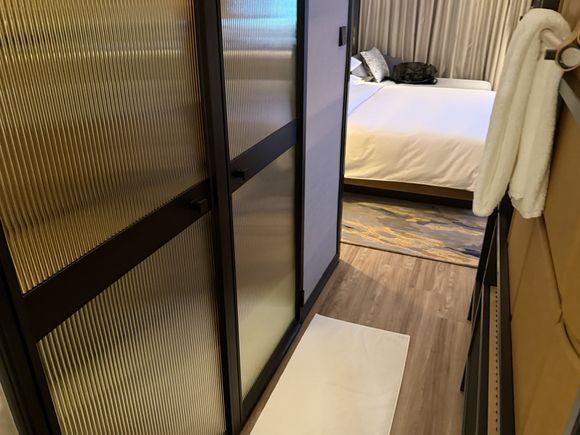 walkway between toilet and hotel room