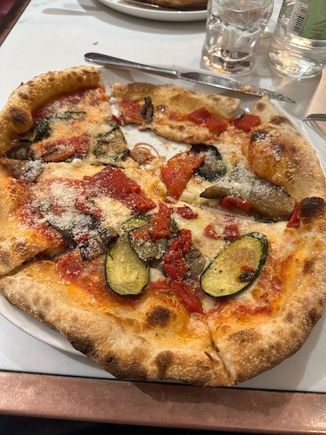 The fabulous Verdure (roasted eggplant, zucchini and peppers) pizza at Harrods Pizza Cafe in London. One of my all-time favorites. Sorry, I got a bit anxious to taste before I took the pic.  Great tiramisu for dessert (no pic).
