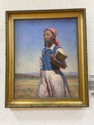 Under the Soviet Union education expanded in Kyrgyzstan. This painting is in honor of that and depicts a Kyrgyz girl getting an education. 