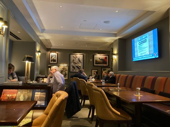 Seating area of the lounge , TV is set on local NYC news 