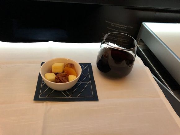 A rough Pinot Noir and a nut, cheese and dried apricot selection that was interesting for the spicy oil dribbled in it. 
