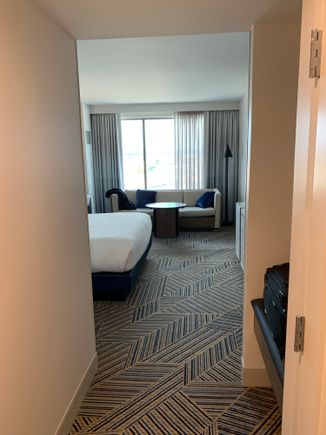 Room with couch and King bed 