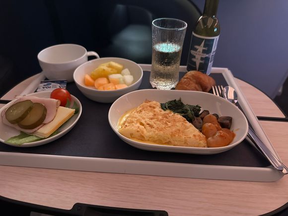 This was breakfast on an unexpected HEL-LHR flight I got rebooked onto after a delay caused us to miss the HEL-EDI flight. Luckily it was on their A350. However, since I was rebooked with only an hour's notice I of course did not get my special meal. It wasn't a big deals since the only meat was part of the cold cuts. The omelette was potato with a very buttery sauce.